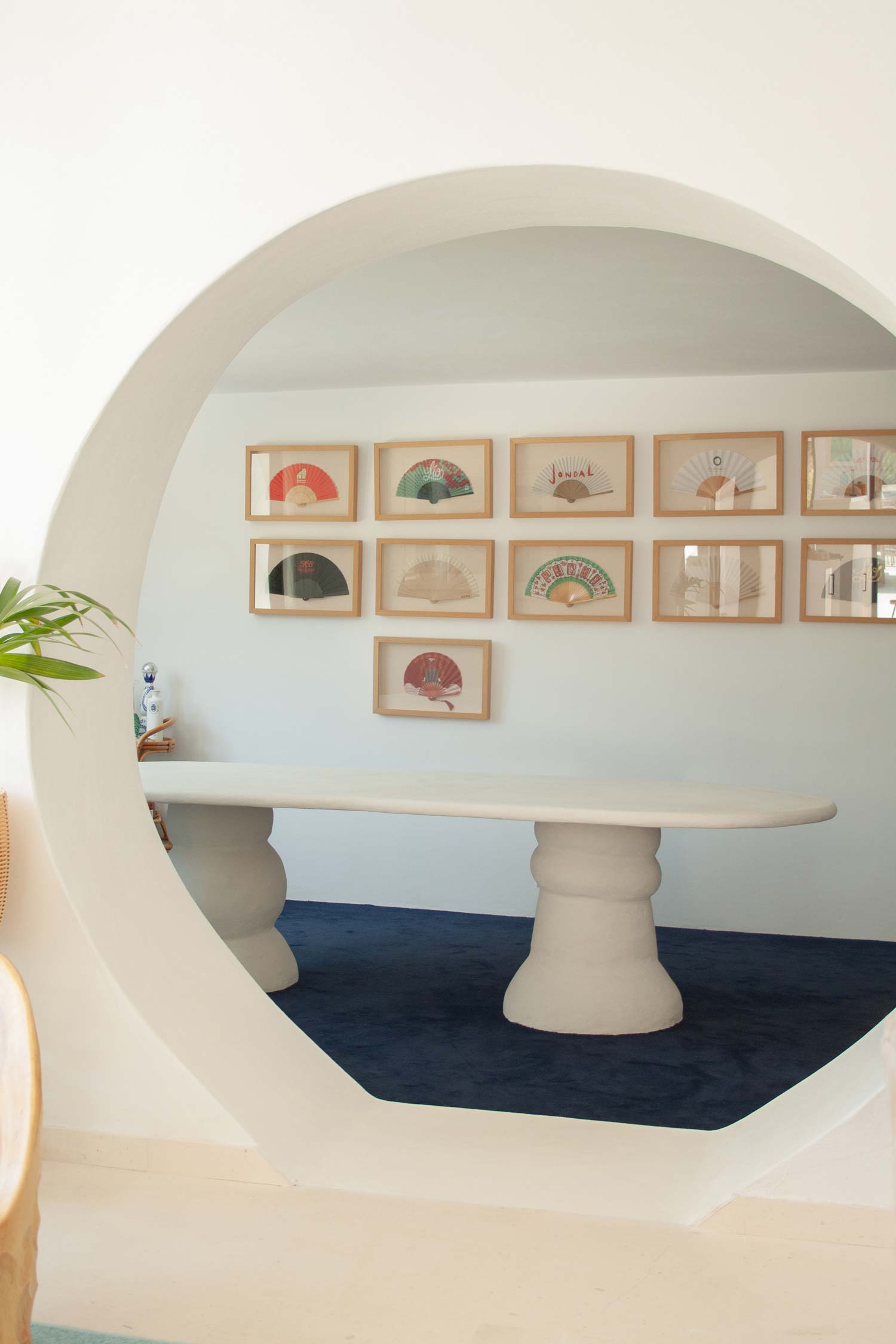 Custom made dining table, Ibiza, called “Artefact dining table“ with two artefact, totem like bases and a long oval playful imperfect shape tabletop. Materials are hempcrete, limestone, wood, mortex. design by studio jannis schaefer